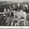 High school coach giving last minute instructions to substitute who is going into the game. Basketball game, Eufaula, Oklahoma