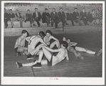 Basketball players resting between periods. Eufaula, Oklahoma