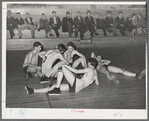 Basketball players resting between periods. Eufaula, Oklahoma