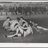 Basketball players resting between periods. Eufaula, Oklahoma