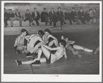 Basketball players resting between periods. Eufaula, Oklahoma