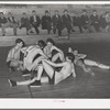 Basketball players resting between periods. Eufaula, Oklahoma