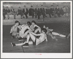 Basketball players resting between periods. Eufaula, Oklahoma