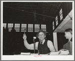Auctioneer at sale of beef steers and breeding stock at San Angelo Fat Stock Show. San Angelo, Texas