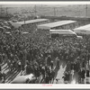 Crowd leaving the rodeo at the San Angelo Fat Stock show, San Angelo, Texas