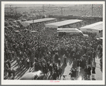 Crowd leaving the rodeo at the San Angelo Fat Stock show, San Angelo, Texas
