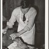 FSA supervisor making sausage during a meat cutting demonstration before FSA officials and supervisors at a district meeting at San Angelo, Texas