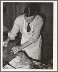 FSA supervisor making sausage during a meat cutting demonstration before FSA officials and supervisors at a district meeting at San Angelo, Texas