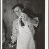 FSA supervisor exhibiting the type of knife he used in his meat cutting demonstration before a group of FSA supervisors and officials at a district meeting at San Angelo, Texas