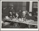 Cattlemen and their wives eating at a restaurant on the grounds of the San Angelo Fat Stock Show, San Angelo, Texas