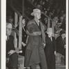 Cattleman with his grandson at auction of beef steers and breeding stock at the San Angelo Fat Stock Show. San Angelo, Texas. The Stetson hat, leather coat and boots are standard everyday wear of ranchmen