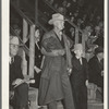 Cattleman with his grandson at auction of beef steers and breeding stock at the San Angelo Fat Stock Show. San Angelo, Texas. The Stetson hat, leather coat and boots are standard everyday wear of ranchmen