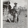 Shearer handling a goat which will be shorn. Kimble County, Texas