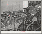 Part of wool scouring machine. The metal forks pull the wool through the hot alkaline solution. Wool scouring plant, San Marcos, Texas