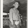 Neighboring ranchman who has been hired to help out during the kidding and shearing on ranch of rehabilitation borrower in Kimble County, Texas
