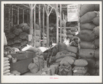 Wool and mohair in storage at Kimble County Wool and Mohair Warehouse, Junction, Texas. This company sells feed for livestock and chickens also