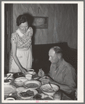 Dinner on ranch of rehabilitation borrower during goat shearing and kidding season. Kimble County, Texas