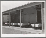 Rows of laundry tubs at the migratory labor camp at Sinton, Texas