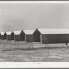 Sheet metal isolation units at the migratory labor camp. Sinton, Texas. These will be used for isolation of people at the camp with contagious diseases of a temporary nature