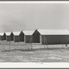 Sheet metal isolation units at the migratory labor camp. Sinton, Texas. These will be used for isolation of people at the camp with contagious diseases of a temporary nature