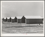 Sheet metal isolation units at the migratory labor camp. Sinton, Texas. These will be used for isolation of people at the camp with contagious diseases of a temporary nature