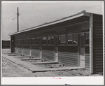 Front of row shelter for migratory workers at the migratory labor camp. Sinton, Texas