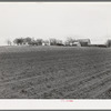 Plowed land in front of farmstead in Williamson County, Texas