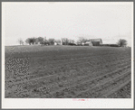 Plowed land in front of farmstead in Williamson County, Texas
