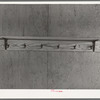 Shelf and hooks in one of the row shelters for migratory workers at the migratory labor camp at Sinton, Texas