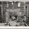 Proprietor of the Navajo Lodge before the fireplace. Datil, New Mexico