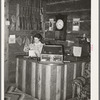 Manageress of Navajo Lodge at the desk. Datil, New Mexico