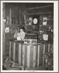 Manageress of Navajo Lodge at the desk. Datil, New Mexico