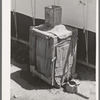 Morman refrigerator used by caretaker at Tonto National Monument. Gila County, Arizona. Water placed in tin container on top drips over the burlap and rapid evaporation in the atmosphere produces the cooling effect