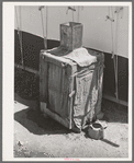 Morman refrigerator used by caretaker at Tonto National Monument. Gila County, Arizona. Water placed in tin container on top drips over the burlap and rapid evaporation in the atmosphere produces the cooling effect