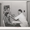 Examination by doctor at the clinic of the Agua Fria migratory labor camp. Arizona