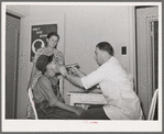 Examination by doctor at the clinic of the Agua Fria migratory labor camp. Arizona