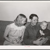 Member of the Arizona part-time farms with his wife and child. Maricopa County, Arizona. Chandler Unit