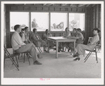 Meeting of the Ladies Aid Society with the camp manager at the Agua Fria migratory labor camp, Arizona. The Ladies Aid Society is mainly concerned with helping needy arrivals at the camp and sick persons
