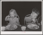 Children eating lunch at WPA (Work Projects Administration) nursery school at the Agua Fria migratory labor camp. Arizona