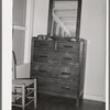 Dresser in bedroom of an apartment at the Arizona part-time farms. Maricopa County, Arizona. The furniture in the apartment on this project was designed especially for them