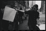 Sylvia Rivera with "Gay Power Now" sign at Gay Liberation Front women's demonstration at City Hall, New York