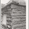Detail of corner of slab house, Pie Town, New Mexico. Sawmill gives these slabs to farmers who will haul them away;