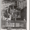 Backyard of house with steps leading up the hill to privy. Mogollon, New Mexico