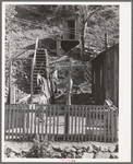 Backyard of house with steps leading up the hill to privy. Mogollon, New Mexico