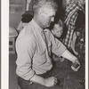 Mr. Besson, formerly an Oklahoma tenant farmer, playing Forty-two at party after literary society. Pie Town, New Mexico