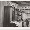 Mrs. Faro Caudill ironing. Pie Town, New Mexico. Mrs. Caudill was born and finished high school at Sweetwater, Texas, before coming with her husband to Pie Town, New Mexico, to homestead