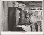 Mrs. Faro Caudill ironing. Pie Town, New Mexico. Mrs. Caudill was born and finished high school at Sweetwater, Texas, before coming with her husband to Pie Town, New Mexico, to homestead