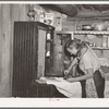 Mrs. Faro Caudill ironing. Pie Town, New Mexico. Mrs. Caudill was born and finished high school at Sweetwater, Texas, before coming with her husband to Pie Town, New Mexico, to homestead