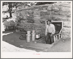 Faro Caudill, homesteader, coming up out of his dugout. Pie Town, New Mexico