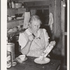 Mrs. Holley Sr. eating ice cream from the dasher. Pie Town, New Mexico